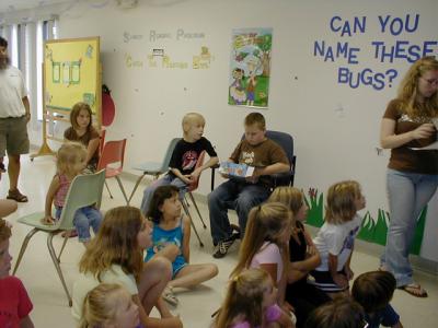 children participating in a summer reading program event